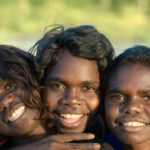 Three smiling Aboriginal children 